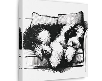 May include: Black and white illustration of a dog sleeping on a couch. The dog is curled up on a pillow and has its paws tucked under its body.