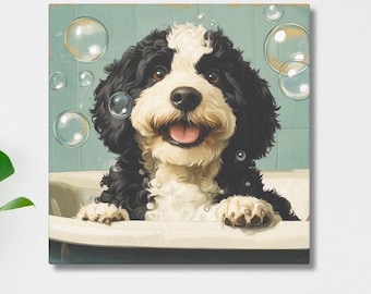 May include: A square canvas print of a happy dog in a bathtub, surrounded by bubbles. The dog has black and white fur and is smiling with its tongue out. The background is a light blue color.