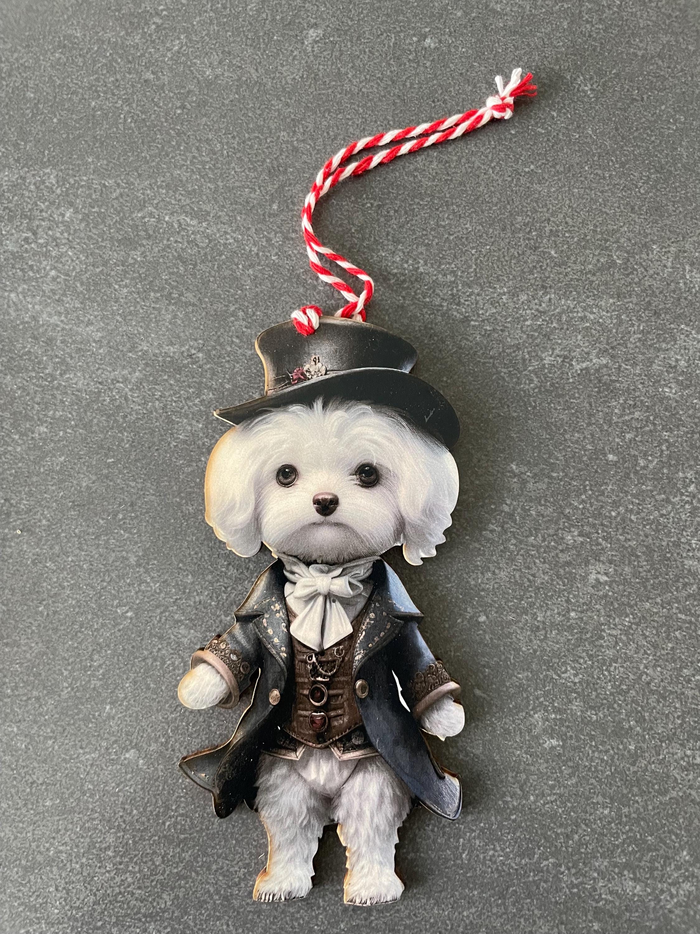 White fluffy dog in clothes  Christmas ornament. Decorative hanger