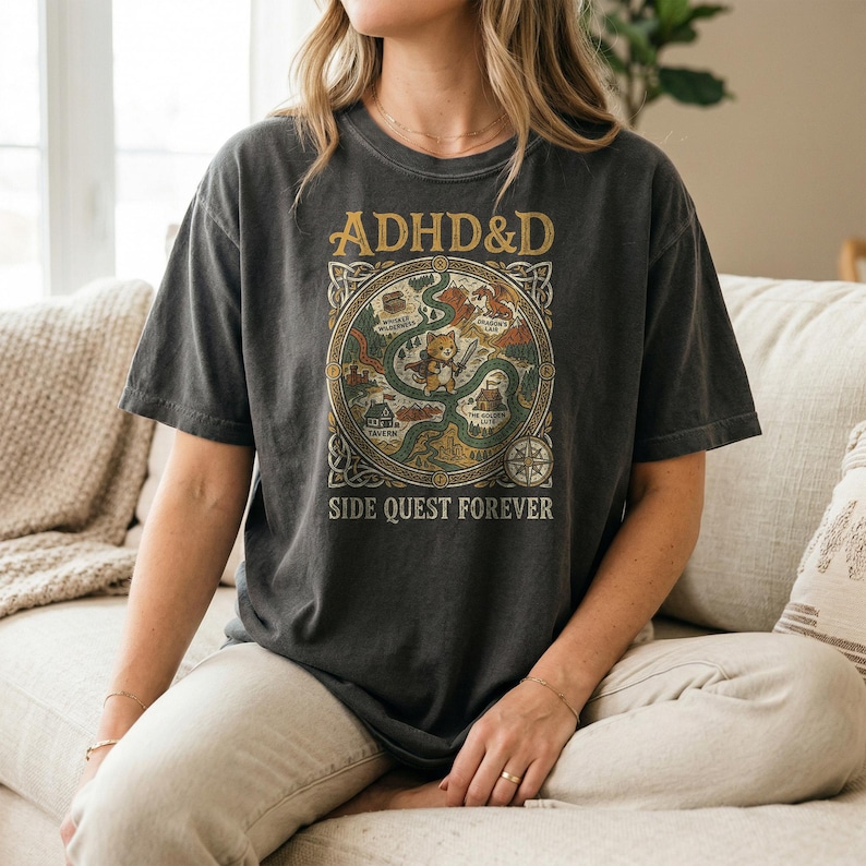 T-shirt with "ADHD&D SIDE QUEST FOREVER" and circular graphic with creatures and text.