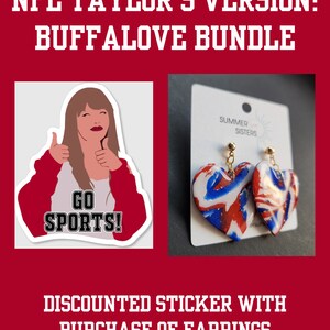 May include: A sticker featuring a cartoon woman with red hair and a red shirt giving a thumbs up with the text "Go Sports!" and a pair of heart-shaped earrings with a red, white, and blue swirl design. The text "NFL Taylor's Version: Buffalove Bundle" and "Discounted Sticker with Purchase of Earrings" is also visible.