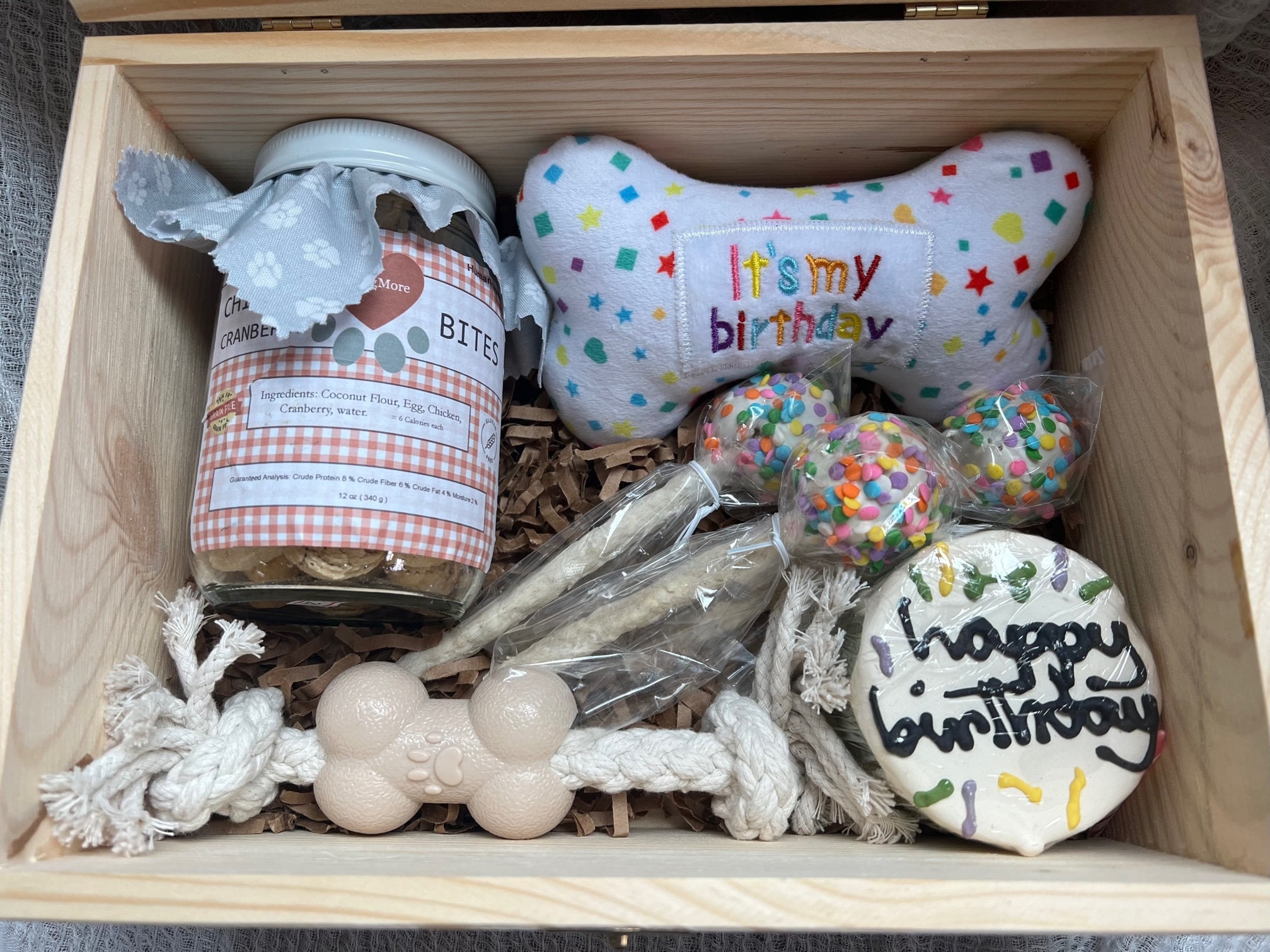 Puppy/Dog Birthday Box. This party Pup pack has cake, cake pops, squeaky birthday bone and forever keepsake wooden box for toys n stuff.