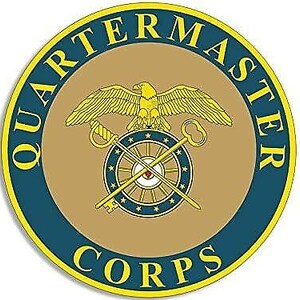May include: A blue and gold circular emblem with the words "Quartermaster Corps" in a yellow banner. A golden eagle with outstretched wings is centered above a wheel with spokes and keys.