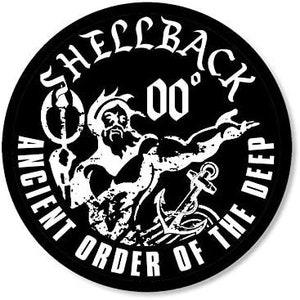 May include: Black and white circular patch with the text "Shellback 00' Ancient Order of the Deep" in a stylized font. A white image of a merman holding a trident and an anchor is in the center.