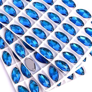 Cristal de vidrio Bermuda Blue 3223 para coser, 9 x 18 mm, parte trasera plana, piedras preciosas K9 premium, color azul Capri violeta