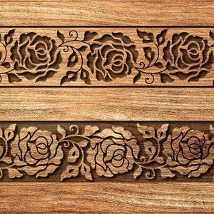 May include: Two rectangular wooden panels with carved floral designs. Each panel features a repeating pattern of roses and leaves, creating a decorative border. The wood has a warm, natural tone.