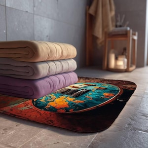 Puede incluir: Una alfombrilla de baño rectangular con un estampado artístico vibrante de una guitarra eléctrica con un acabado desgastado en azul y naranja. El diseño de la guitarra se sitúa sobre un fondo de madera rústica y texturizada, creando contraste.