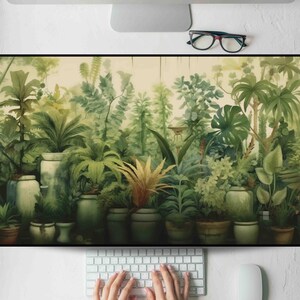May include: A botanical-themed wall art print featuring a lush, green watercolor illustration of various potted plants and foliage. The artwork showcases a variety of textures and shades of green, creating a vibrant and natural aesthetic. The print is displayed on a white surface.