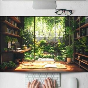 May include: A serene interior scene featuring a home office with a large window overlooking a lush garden. The room includes a wooden desk, bookshelves, and a small stool. A computer, plants, and an open book are visible. The overall aesthetic is natural and calming.