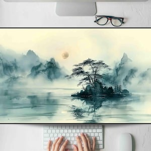 May include: A landscape painting depicting a serene lake scene with misty mountains and a full moon. A small island with a tree is in the center. The color palette includes shades of blue, green, and yellow.