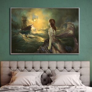 May include: A framed painting depicts a mermaid on a rocky shore, gazing at a ship battling stormy waves. The artwork features a dramatic sky with a bright sun, and the mermaid has long flowing hair and a shimmering tail. The overall color palette is dominated by blues, greens, and golds.