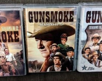 May include: Three DVD cases with Gunsmoke printed on the front. The cases are for seasons 10-12, 13-15, and 16-20.