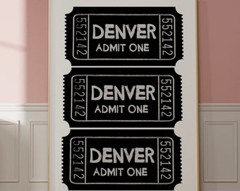 May include: Three black and white ticket-shaped signs with the word "DENVER" and the text "ADMIT ONE" in white. The ticket numbers "552142" are printed on each side of the tickets.