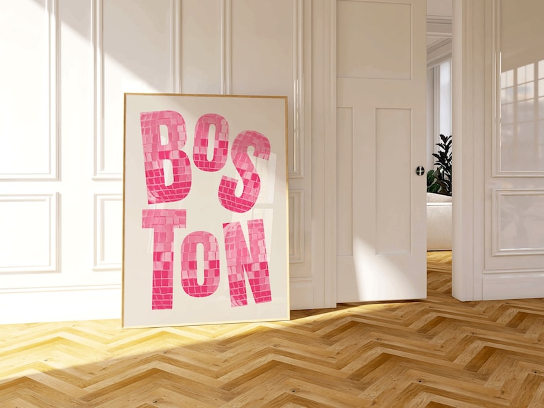 May include: A framed print with the word "BOSTON" in large, pink, mosaic-style letters against a white background.
