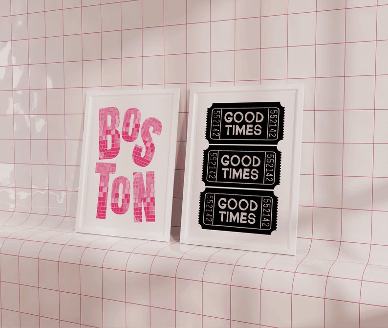 May include: Two framed prints, one with the word "BOSTON" in pink mosaic tiles and the other with three black and white tickets that say "GOOD TIMES" with the ticket number "552142".