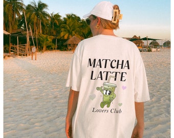 May include: White t-shirt with a green cartoon matcha latte cup graphic and the text "MATCHA LATTE Lovers Club".