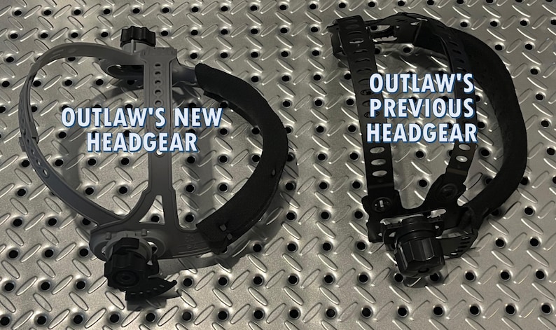 May include: Two welding headgear units are displayed on a textured metal surface. The left unit is gray and labeled "OUTLAW'S NEW HEADGEAR." The right unit is black and labeled "OUTLAW'S PREVIOUS HEADGEAR."