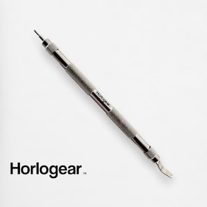 May include: A silver watch repair tool with a textured handle and the word "Horogear" printed on it. The tool has a pointed end and a small blade at the other end.