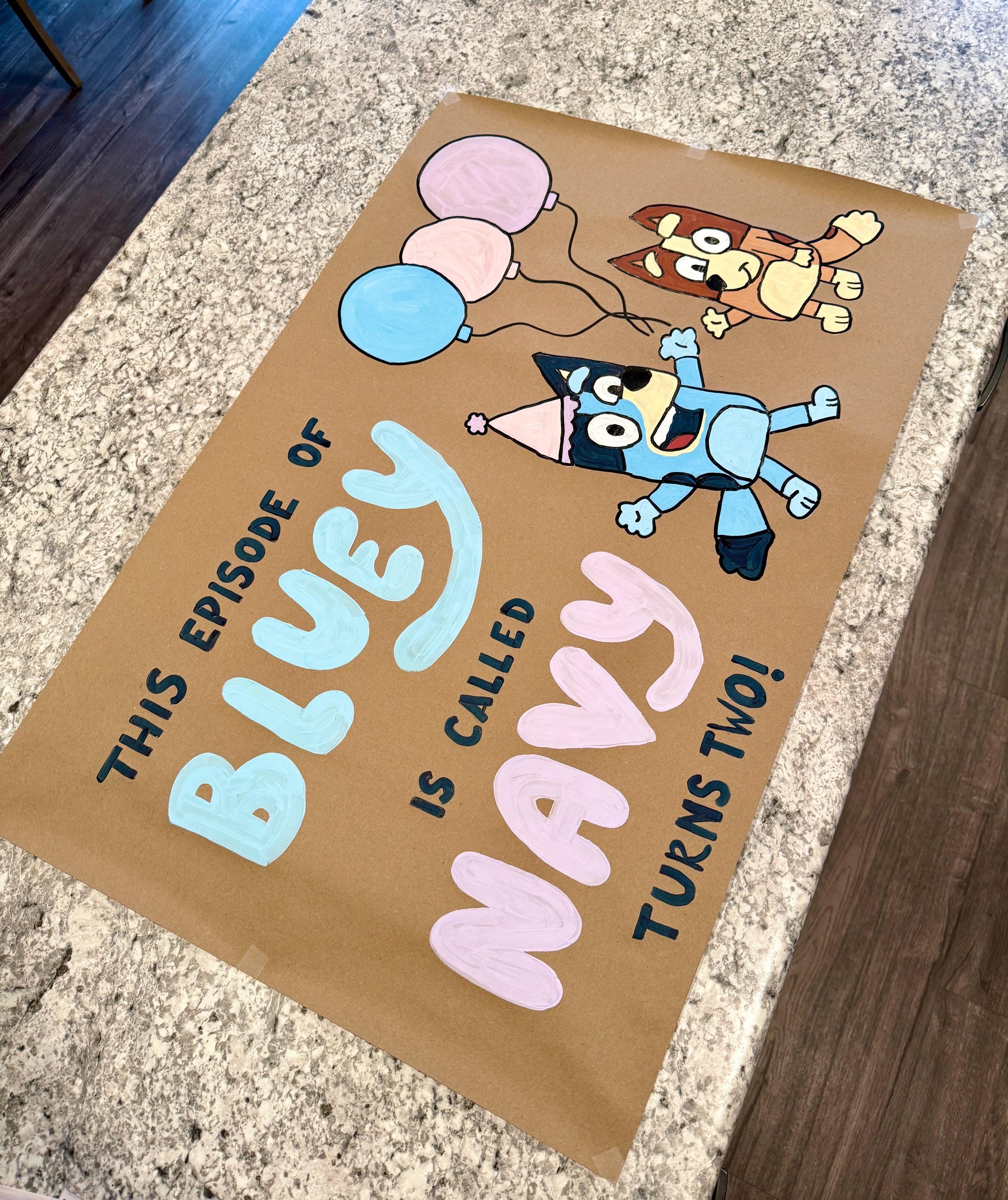 Hand-Painted Bluey Banner – Kraft paper banner with acrylic paint.