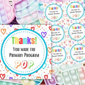 Puede incluir: Un conjunto de etiquetas de agradecimiento imprimibles con un patrón de corazones y confeti coloridos. Las etiquetas presentan un círculo con el texto "¡Gracias! Hiciste que el programa de primaria POP" en un arcoíris de colores.