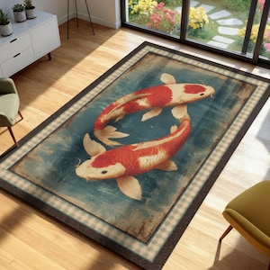 May include: A rectangular area rug featuring two koi fish with white and orange scales swimming in a circular motion against a textured blue background. The rug is framed by a light-colored checkered border and a dark brown outer edge.