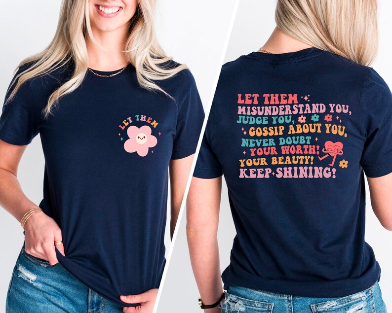 May include: Navy blue t-shirt with a pink flower graphic on the front and a motivational message on the back. The message reads "Let them misunderstand you, judge you, gossip about you, never doubt your worth! Your beauty! Keep shining!"