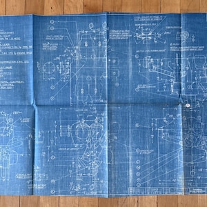 May include: A handmade wooden sign with the word "Welcome" in a playful font. The sign is painted white with a distressed finish, and features a floral design in pinks and greens. It's roughly 30 cm wide.