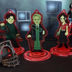 Saw apprentices standee charms