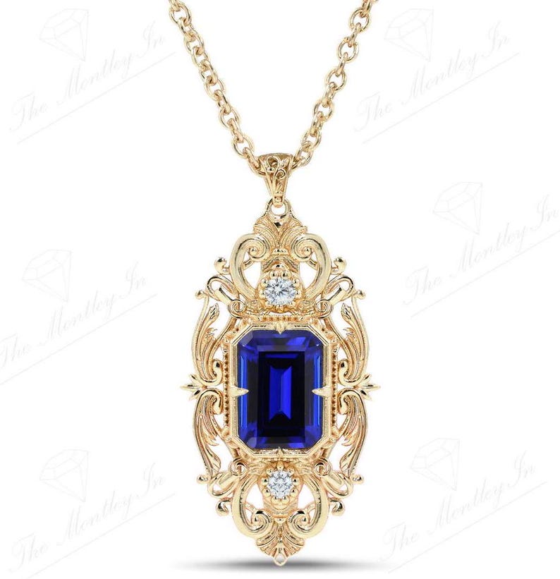 May include: A gold pendant necklace with a large blue sapphire gemstone surrounded by smaller diamonds. The pendant features an intricate, ornate design.