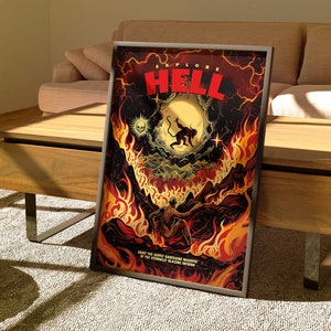 Könnte beinhalten: Ein gerahmtes Poster mit einer feurigen, dunkelroten, orangefarbenen und gelben Illustration eines Dämons mit einem roten Heiligenschein und einer Kreatur mit einem Schwanz, die auf einem Berg steht. Der Text "EXPLORE HELL" ist in roten und weißen Buchstaben. Der Text "ENJOY THE GENTLE CARESSING WARMTH OF THE ETERNALLY BLAZING INFERNO" befindet sich am unteren Rand des Posters.