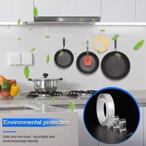 May include: Clear, double-sided adhesive tape for hanging items. The tape is shown in a kitchen setting with pots and pans hanging on a wall. The text "Environmental protection" is visible in the image. The text "Safe and non-toxic, recyclable and environmentally friendly" is also visible in the image.