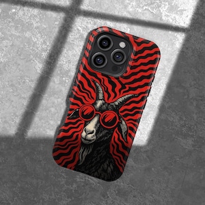 May include: A phone case featuring a black goat wearing red sunglasses against a red and black wavy background. The case has a black border and a camera cutout.