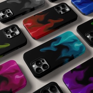 May include: A collection of phone cases with different abstract designs. The cases are black with a variety of colors including red, blue, purple, and green. The cases have a marble-like pattern.