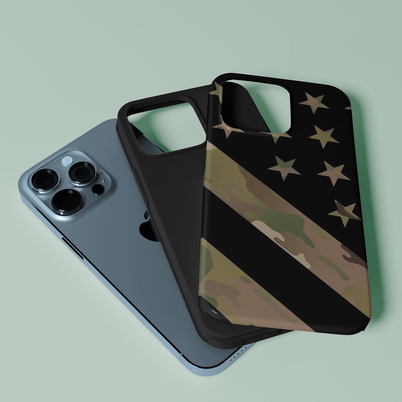 May include: Three phone cases stacked on top of each other. The top case is black with a camouflage and star pattern. The middle case is black. The bottom case is blue.