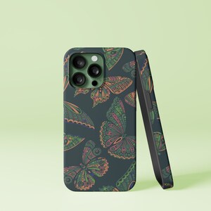 May include: A dark blue phone case with a colorful butterfly pattern. The case has a camera lens cutout and a black side.