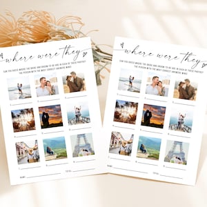 May include: Two white paper game sheets with the text "where were they" and a series of photos. The game asks players to guess the location of the bride and groom in each photo. The sheets are decorated with small heart shapes.