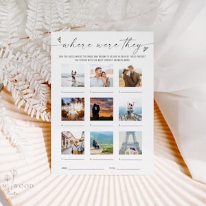 May include: A white card with the text "where were they" and the phrase "CAN YOU GUESS WHERE THE BRIDE AND GROOM-TO-BE ARE IN EACH OF THESE PHOTOS? THE PERSON WITH THE MOST CORRECT ANSWERS WINS!". The card has nine photo slots and lines for name and total.
