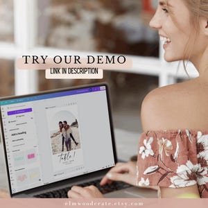 May include: A laptop screen displaying a mockup of a wedding table number card with a photo of a couple in the background. The text on the card reads "Table 1". The laptop is on a table with a person sitting in front of it.