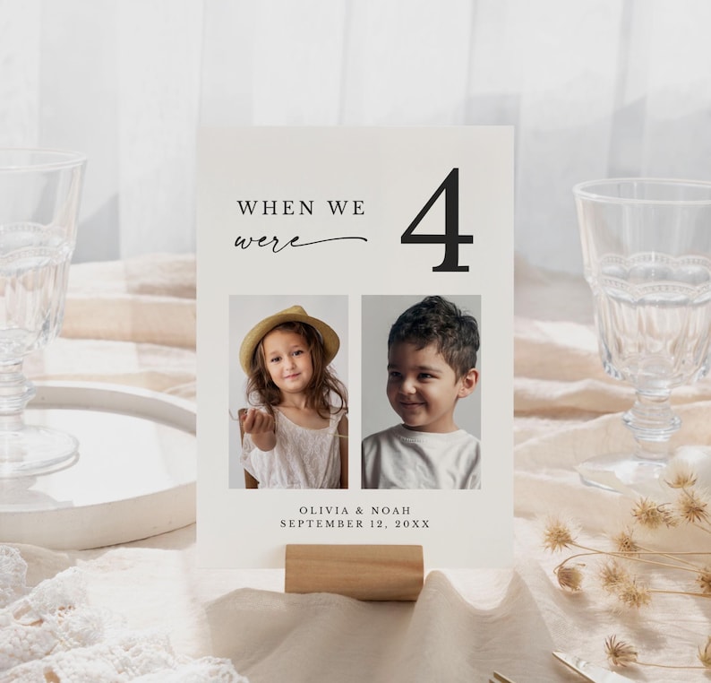 May include: A cream-colored photo card with the text "WHEN WE were 4" and two photos of children. The card includes the names Olivia & Noah and the date September 12, 20XX. The card is held by a small wooden block.