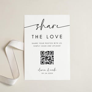May include: A white card with black text that says "share THE LOVE" and has a QR code. The text below the QR code says "olivia & noah 09.24.20XX".