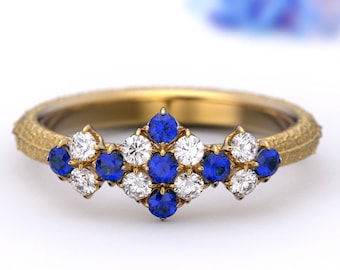Nature-inspired engagement ring, handmade in Italy, with cluster of diamonds and natural blue sapphire in solid 14k or 18k gold.