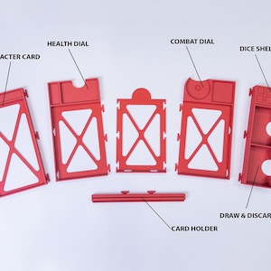 May include: A set of red plastic gaming components including a character card frame, a health dial, a combat dial, a dice shelf, a draw and discard tray, and a card holder. Each piece features labeled text indicating its specific function.