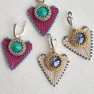 May include: Four beaded heart-shaped earrings. Two earrings are magenta with turquoise accents and a central teal stone. The other two are cream and gold with a central gray stone. All have silver-tone ear wires.
