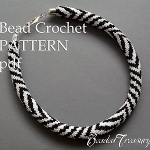 May include: A black and white beaded crochet necklace with a chevron pattern. The necklace has a silver clasp and is displayed on a grey background. Text on the image reads "Bead Crochet PATTERN pdf" and "Beaded Treasury".