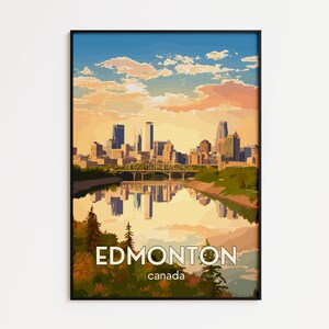 May include: A framed art print featuring a stylized illustration of the Edmonton, Canada skyline at sunset. The image displays a city skyline, a bridge over a river, and a reflection in the water, with the text EDMONTON canada at the bottom.