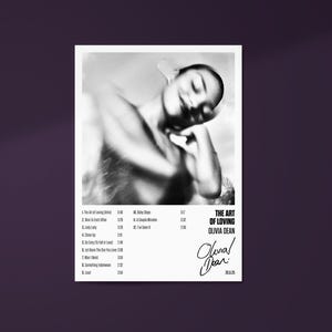 May include: Monochrome album cover for Olivia Dean's "The Art of Loving." The image shows a blurred artistic photo of a person. The album title and artist name are displayed in a modern font. A tracklist and signature are also visible.