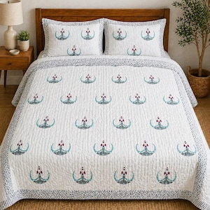 May include: White quilt set with a repeating pattern of red, gray, and teal rockets launching from a teal arc. The set includes a quilt and two pillow shams. The border of the quilt and shams features a gray and white patterned design.