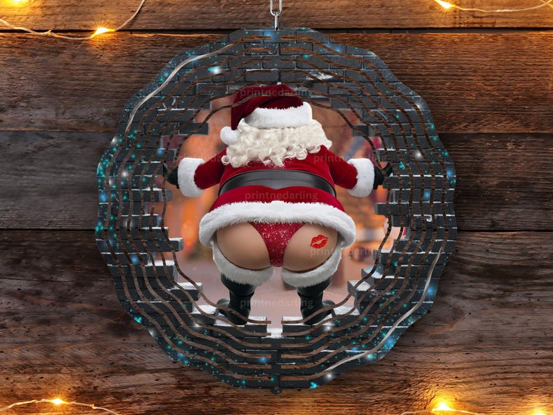 May include: A black and blue circular metal ornament with a brick pattern. A Santa Claus figure is seen in the center of the ornament, wearing a red suit and a white beard. The Santa Claus figure is partially obscured by the brick pattern.