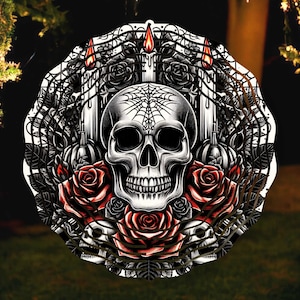 May include: A black and white illustration of a skull with a spiderweb design, surrounded by roses and candles. The skull has a detailed design with a prominent jawline and teeth. The roses are red and have a realistic appearance. The candles are tall and thin, with flames at the top.