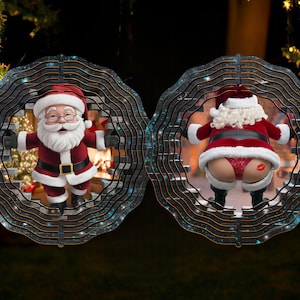 May include: Two round, black and silver, wind spinners with a Christmas theme. One features Santa Claus peeking out of a brick wall, while the other features Santa Claus's backside with a red heart on it.